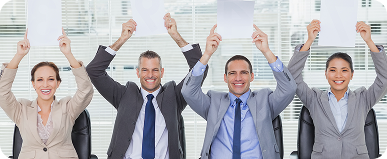 smiling interview panel holding blank sheets their head hiding marks